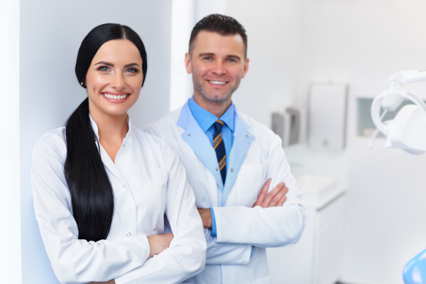 Two dentists together in a clinic at Peak Endodontics in Covington, WA