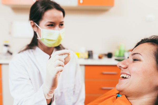 Dentist and patient after an extraction at Peak Endodontics in Covington, WA